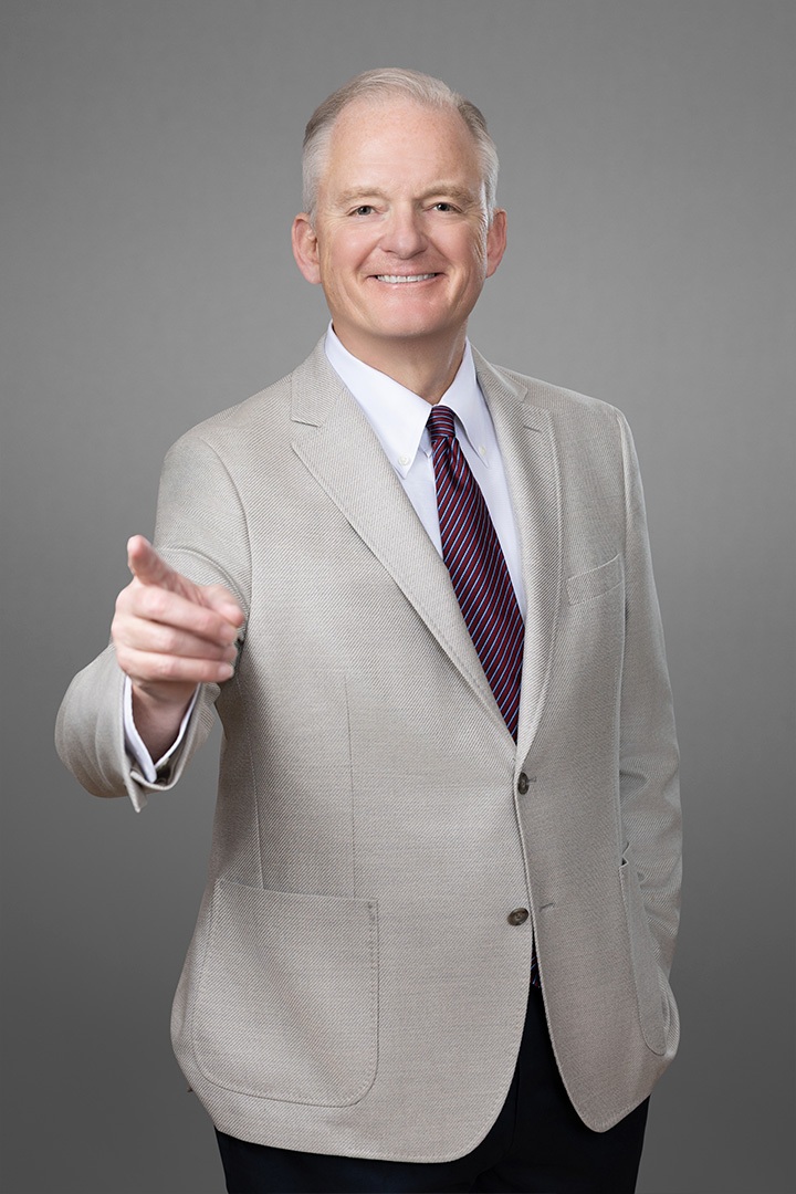 Bill Canady, author of The 80/20 CEO, extending hand in professional portrait.
